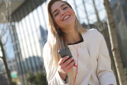 happy young adult listening to a podcast