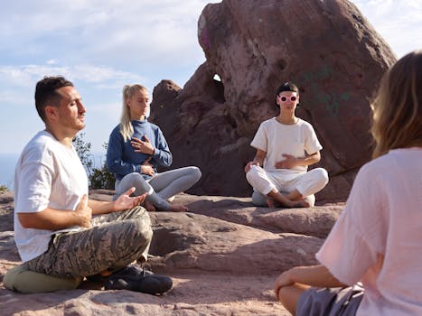 group meditating outdoors
